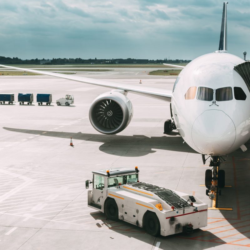 Aircraft Plane Boarding Passengers In Airport Terminal. Aircraft